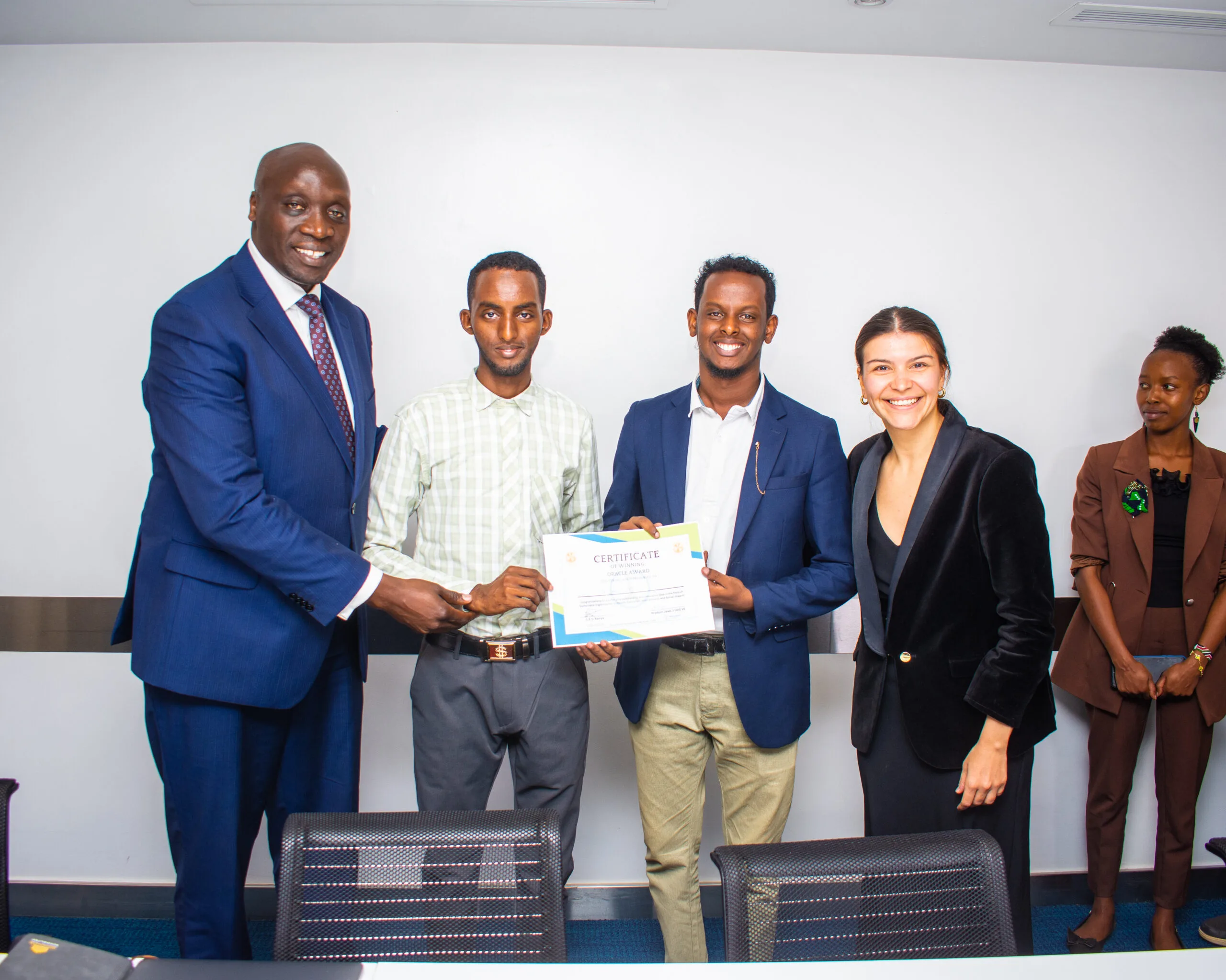 The TechLoom team receiving a certificate at the Stage 2 Oracle Award ceremony, Thousand Young Entrepreneurs 2024, Kenya